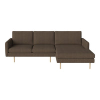 Brown upholstered sectional sofa with modern, minimalist design and light wood legs. Perfect for stylish living spaces.