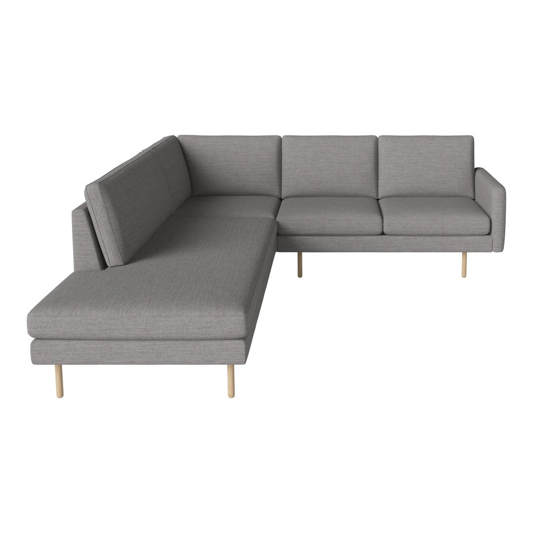 Gray sectional sofa with a modern design and clean lines, featuring smooth upholstery and wooden legs.