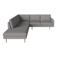 Gray sectional sofa with clean lines and subtle texture, featuring light wooden legs. Ideal for modern living spaces.