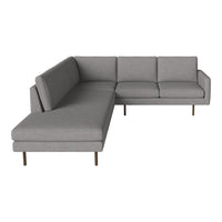 Gray sectional sofa with a minimalist design and smooth fabric, featuring straight lines and simple stitching.