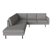 Gray sectional sofa with clean lines and textured fabric, featuring a modern design and minimalist style.