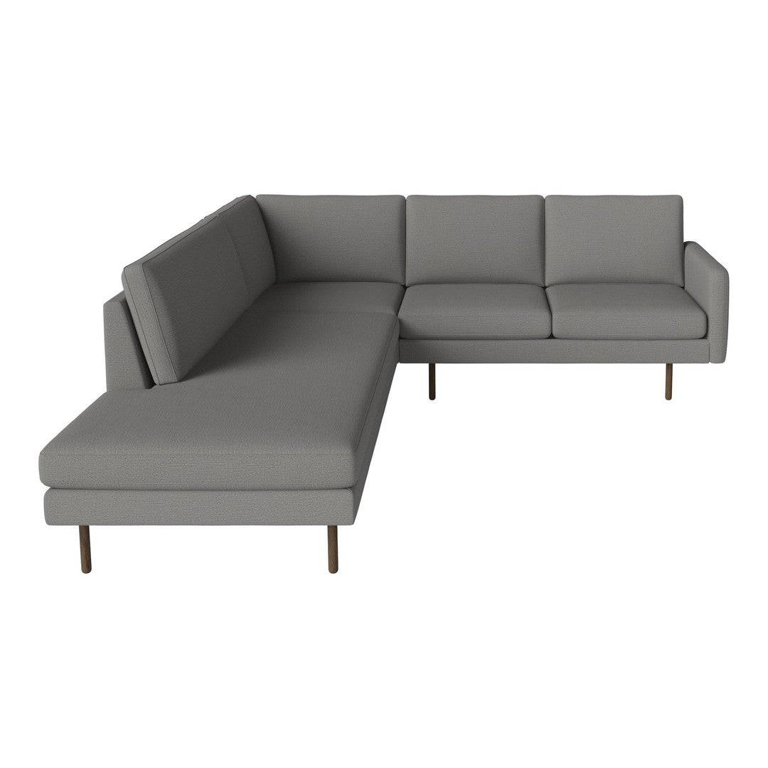 Gray sectional sofa with sleek, modern lines and minimalistic design, featuring a solid gray fabric upholstery.