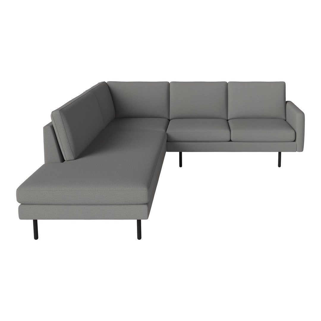 Gray sectional couch with a simple, modern design and clean lines, featuring a solid color finish.