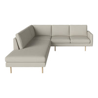 Light gray sectional sofa with clean lines and minimalist design, featuring natural wood legs and no visible patterns.