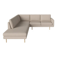 Beige sectional sofa with clean lines and minimalist design, featuring a smooth fabric surface and light wood legs.