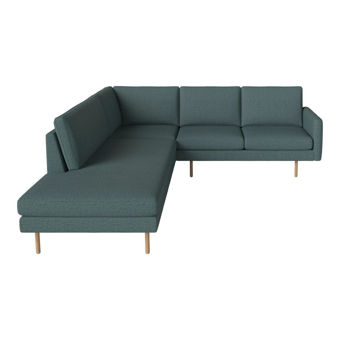 Teal sectional sofa with a modern design and subtle fabric texture, featuring clean lines and wooden legs.