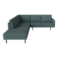 Teal sectional sofa with a modern design, featuring a solid pattern and sleek black legs. Perfect for contemporary decor.