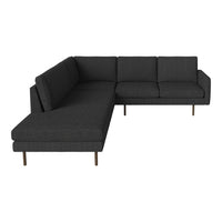 Modern dark gray sectional sofa with a textured fabric and sleek design, featuring clean lines and minimalist style.