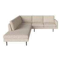Beige sectional sofa with a smooth, solid fabric pattern and minimalist design, featuring light wood legs.