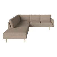 Beige sectional sofa with a modern design and smooth fabric, featuring subtle texture and minimalistic style.