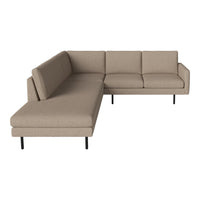 Beige sectional sofa with a sleek design and minimalist style, featuring smooth upholstery and black metal legs.