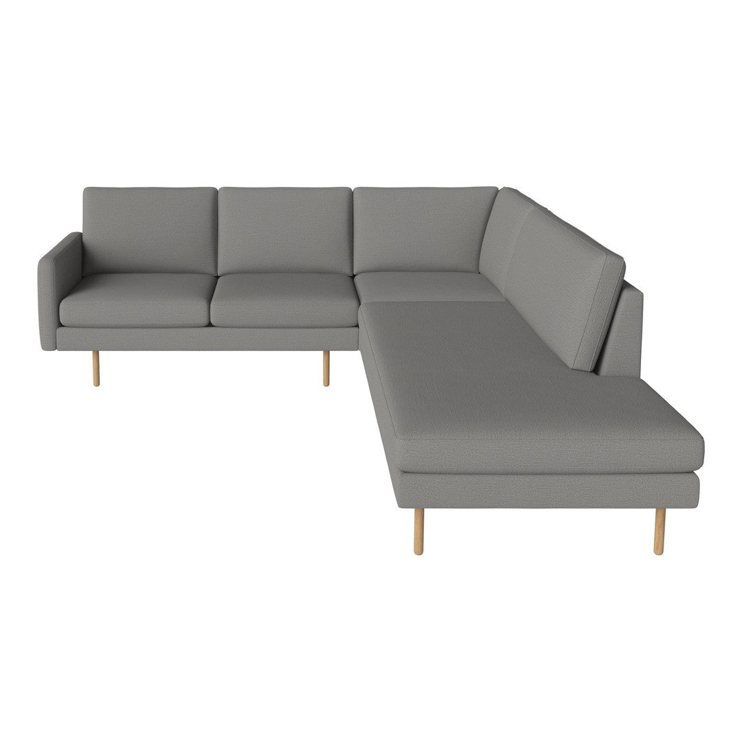 Gray sectional sofa with a modern design, featuring clean lines and light wood legs for a minimalist touch.