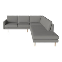 Gray sectional sofa with a modern design, featuring clean lines and light wood legs for a minimalist touch.