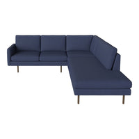 Navy blue sectional sofa with clean lines and minimalistic design, featuring solid fabric without patterns.