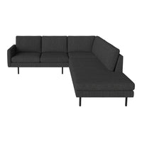 "Modern dark gray sectional sofa with sleek black legs and textured fabric upholstery."