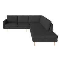 Dark grey sectional sofa with a modern pattern and light wooden legs, ideal for contemporary living spaces.