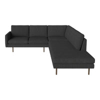 Modern L-shaped sofa in dark gray fabric with clean lines and minimalistic design, featuring wooden legs.