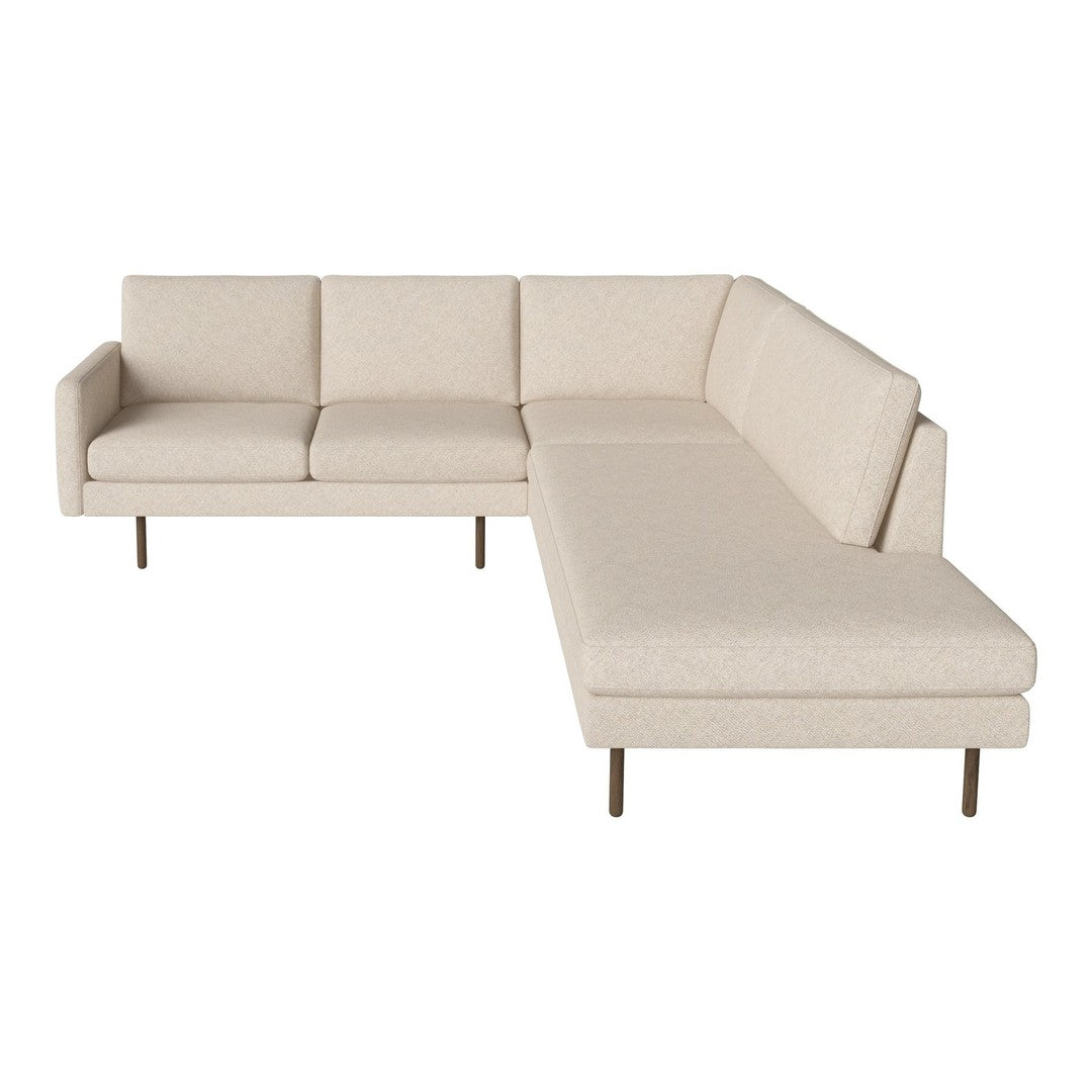 Beige sectional sofa with clean lines and textured fabric, featuring a minimalist design and metal legs.