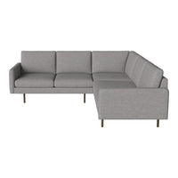 Gray sectional sofa with clean lines and smooth fabric finish, featuring a minimalist design and subtle textures.
