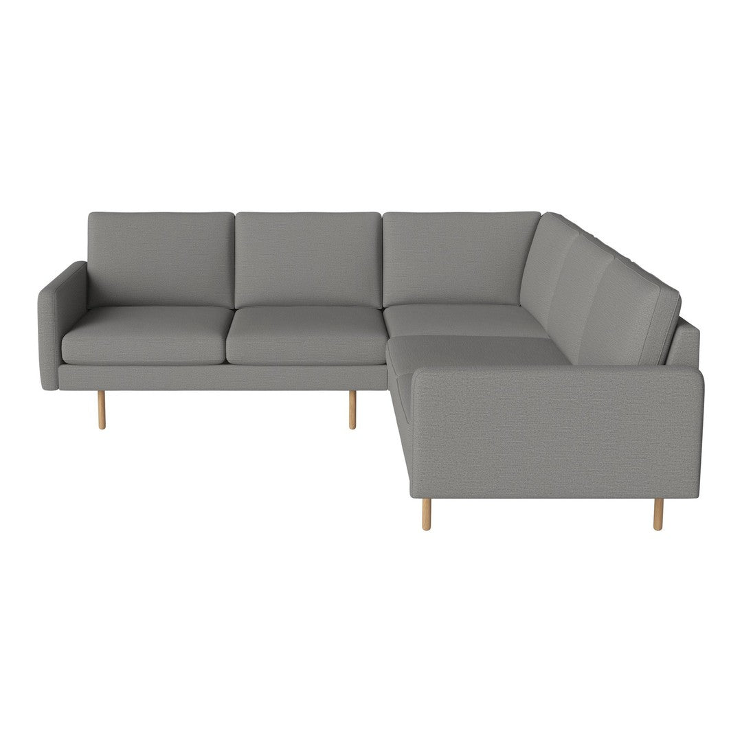Gray sectional sofa with clean lines and minimalistic design, featuring smooth fabric and light wood legs.
