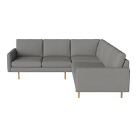 Gray sectional sofa with clean lines and minimalistic design, featuring smooth fabric and light wood legs.