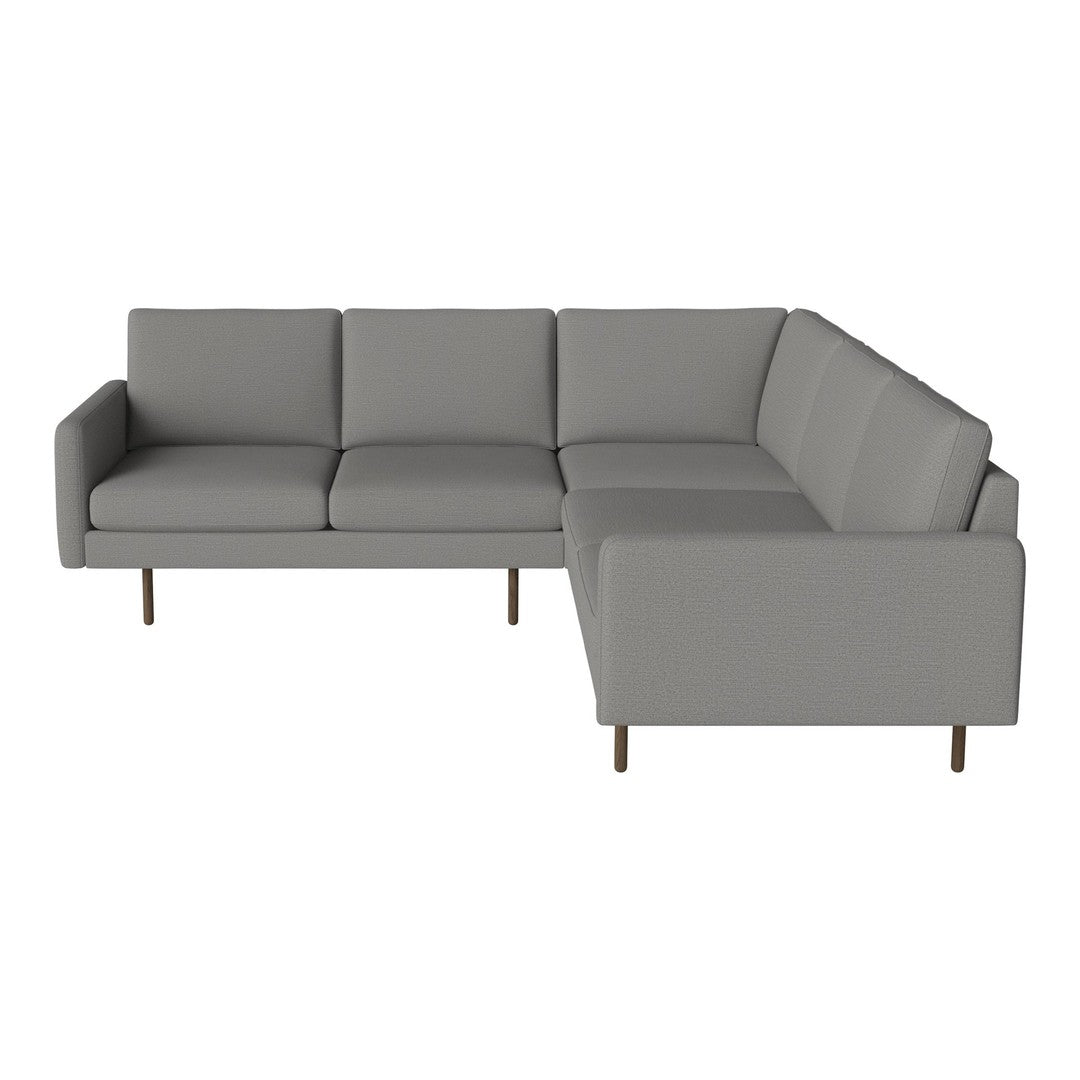 Gray sectional sofa with smooth fabric and modern design, featuring clean lines and minimalistic style.