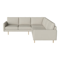 Light beige sectional sofa with clean lines and minimalist design, featuring smooth fabric and natural wood legs.
