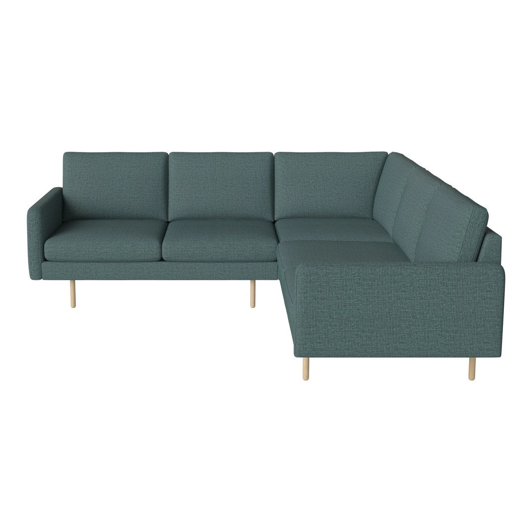 Teal sectional sofa with a textured pattern and light wooden legs, perfect for modern living spaces.