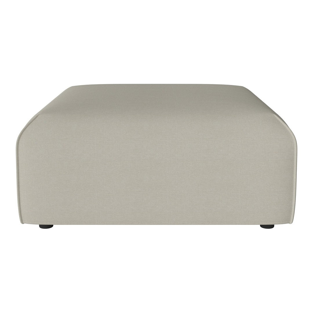 Beige rectangular ottoman with smooth, solid fabric and rounded edges. Perfect for modern living spaces.