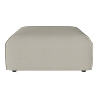 Beige rectangular ottoman with smooth, solid fabric and rounded edges. Perfect for modern living spaces.