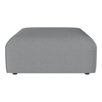 Gray upholstered ottoman with a subtle textured pattern and rounded edges, perfect for modern living spaces.