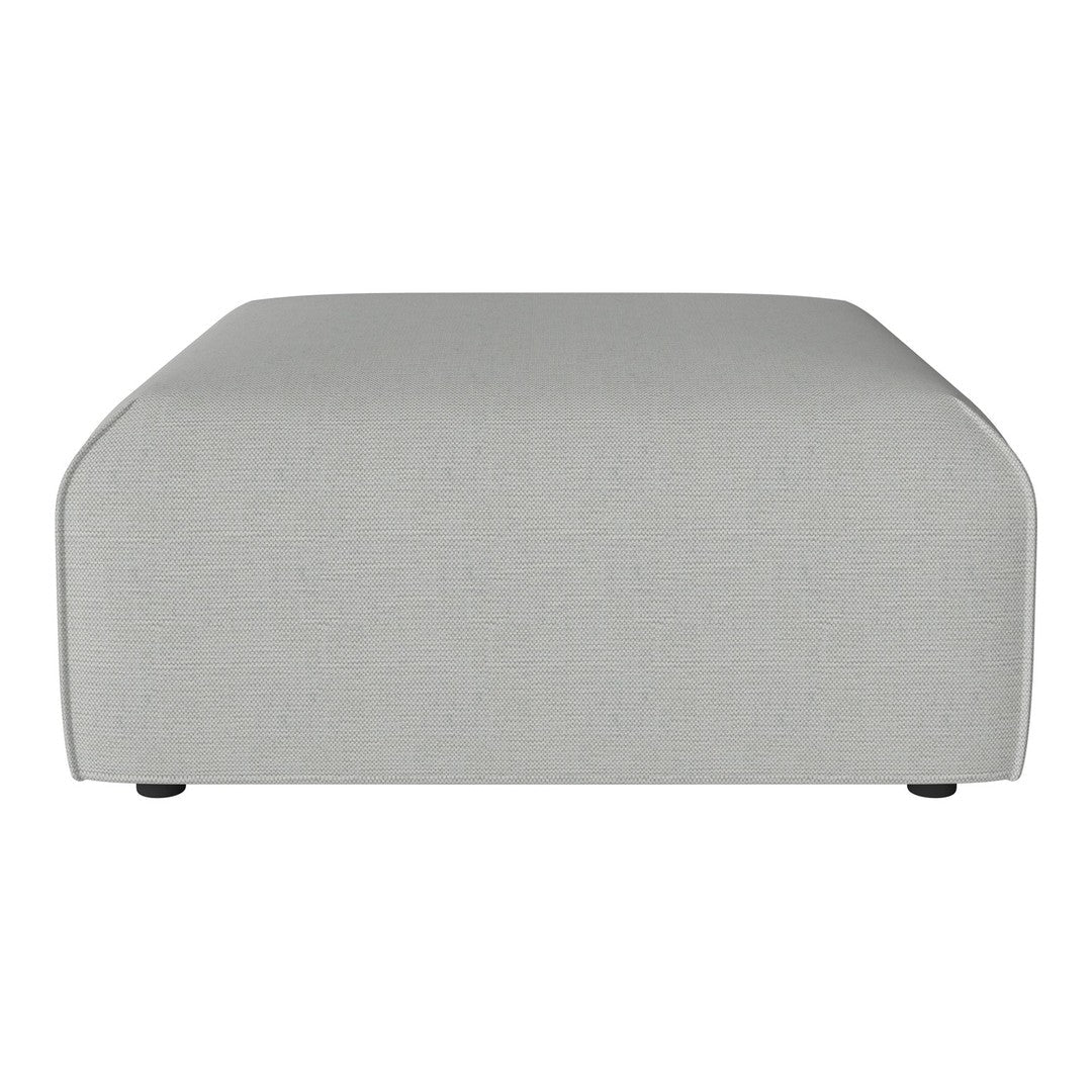 Light gray, textured fabric ottoman with soft, rounded edges; minimalistic design suitable for modern decor.