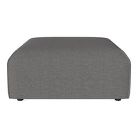 Gray upholstered ottoman with a smooth, textured finish and curved edges for a modern aesthetic.