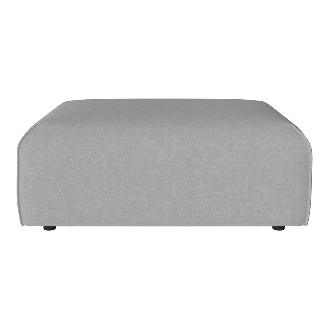 Gray fabric ottoman with a smooth, minimalist design and subtle curved edges, ideal for modern decor.
