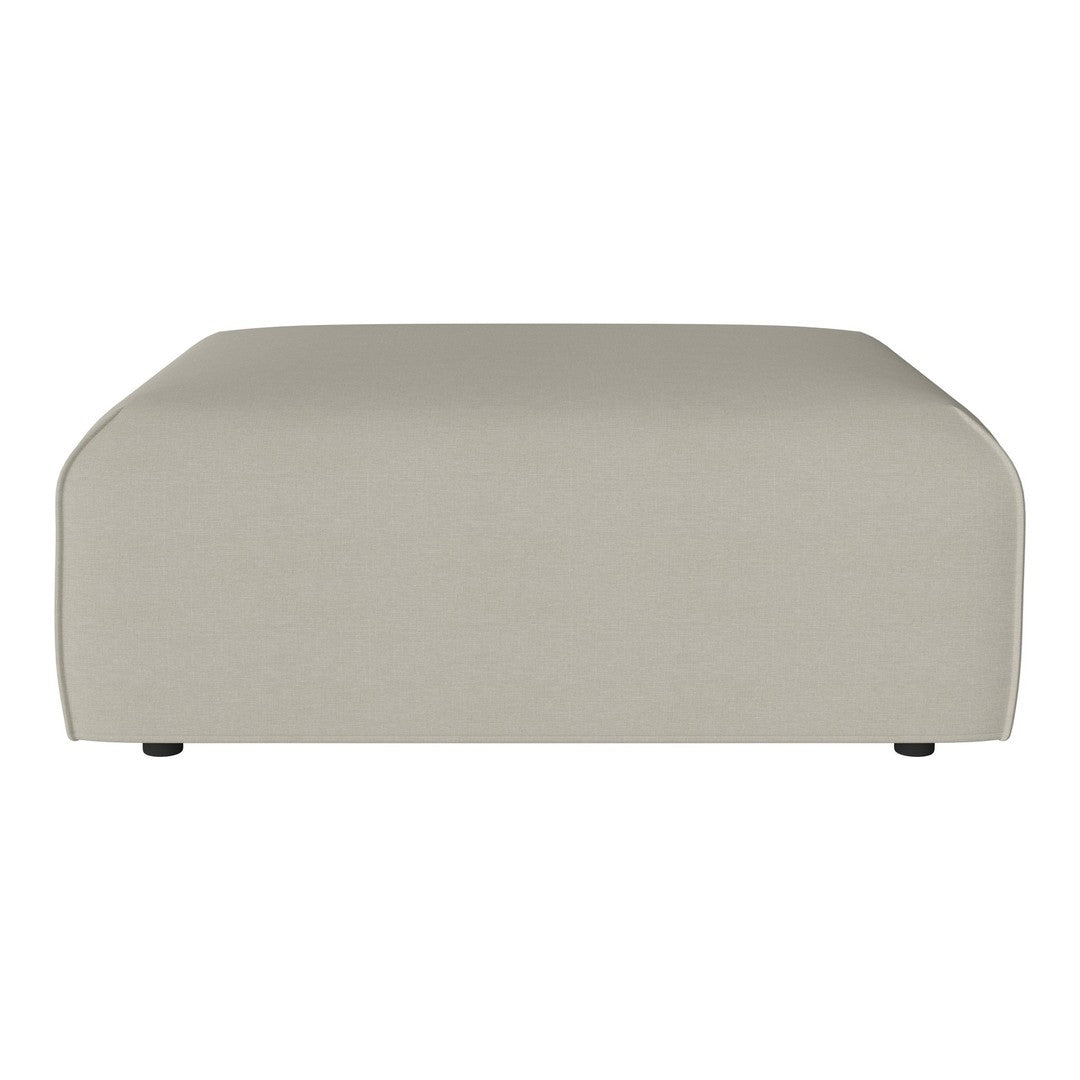 Beige upholstered ottoman with a smooth, minimalist design and rounded edges. Perfect for modern decor.