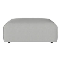 Gray rectangular ottoman with a smooth fabric surface and rounded edges, perfect for modern interiors.