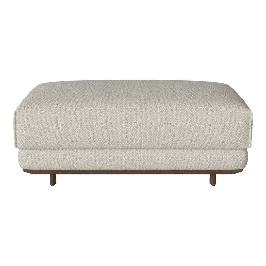 Beige upholstered ottoman with a smooth texture and a sturdy wooden base. Simple and modern design for versatile decor.