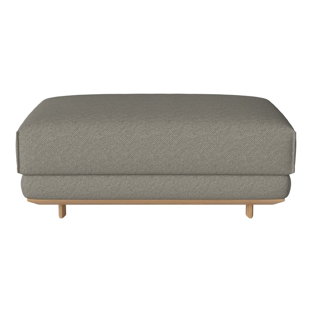 Gray upholstered ottoman with a smooth finish and light wooden legs, featuring a subtle textured pattern.