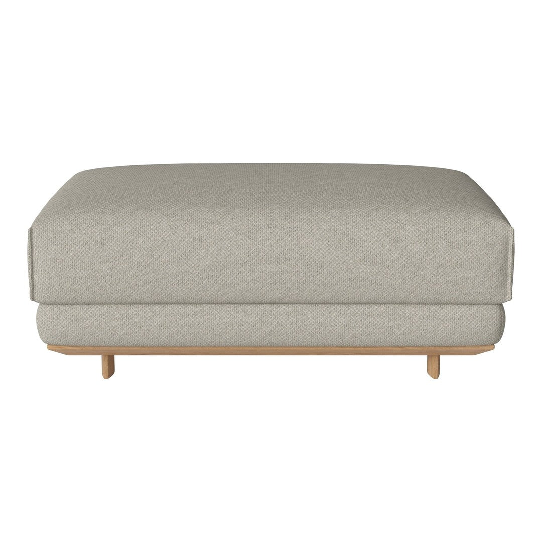 Light gray upholstered ottoman with a smooth texture and minimalist wooden legs, enhancing modern decor.