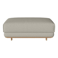 Light gray upholstered ottoman with a smooth texture and minimalist wooden legs, enhancing modern decor.