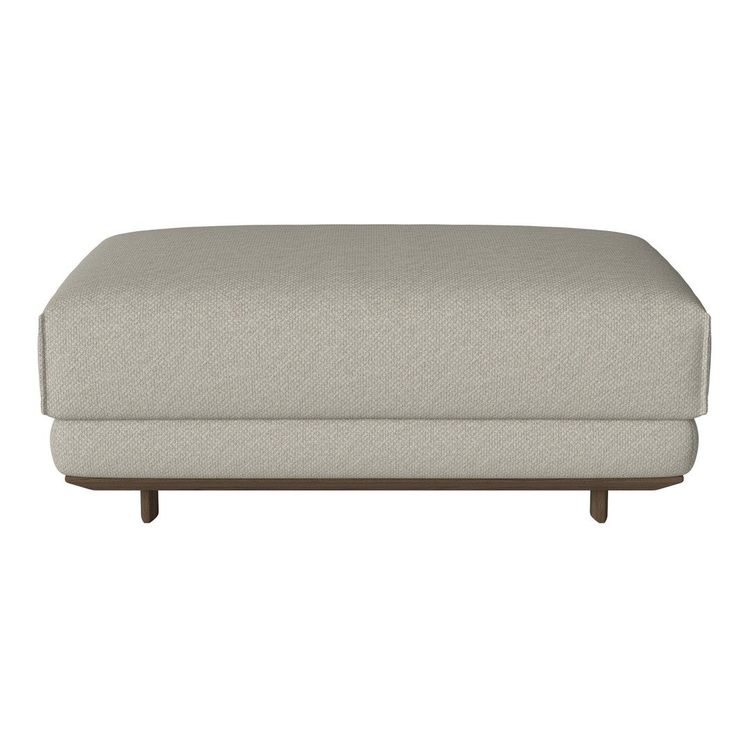 Light beige ottoman with a smooth texture and minimalist design, featuring a solid wood base and no visible patterns.