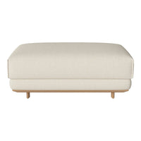 Cream-colored ottoman with a smooth texture and minimalist design, featuring natural wood legs.