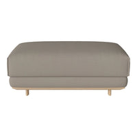Light gray upholstered ottoman with smooth texture and minimalist design, featuring natural wood legs.