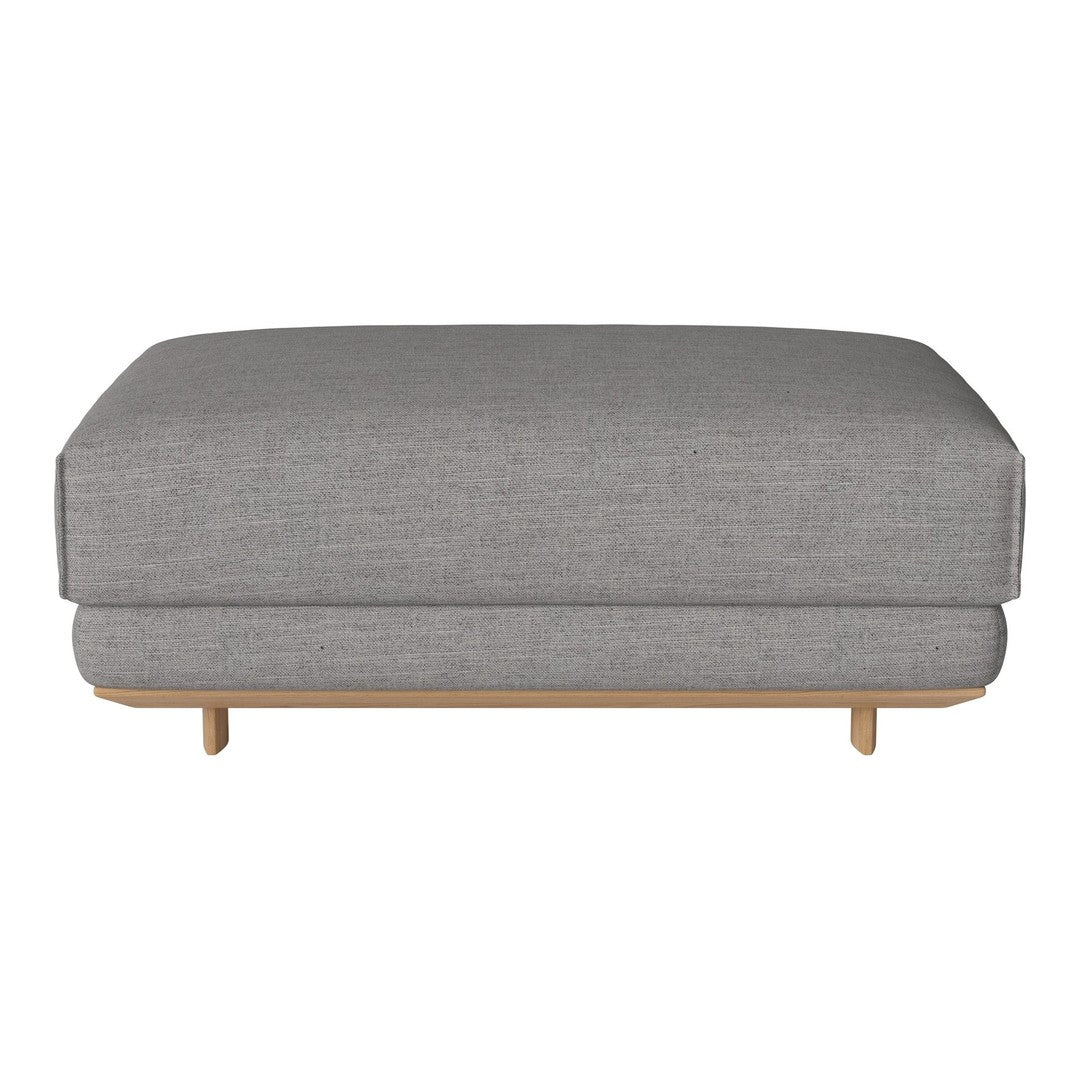 Gray upholstered ottoman with a smooth texture and wooden legs, featuring a minimalist design.