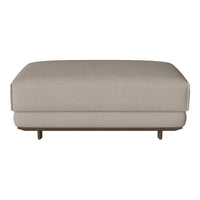 Beige upholstered ottoman with a smooth surface and wooden legs. Simple, modern design for versatile decor.