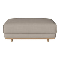 Neutral beige ottoman with a smooth fabric finish and natural wooden legs, perfect for modern decor.