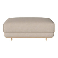 Light beige upholstered ottoman with a smooth texture and minimalist design on wooden legs. Ideal for versatile decor.