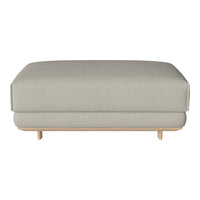 Light gray upholstered ottoman with a simple, clean design and natural wood legs. Ideal for modern decor.