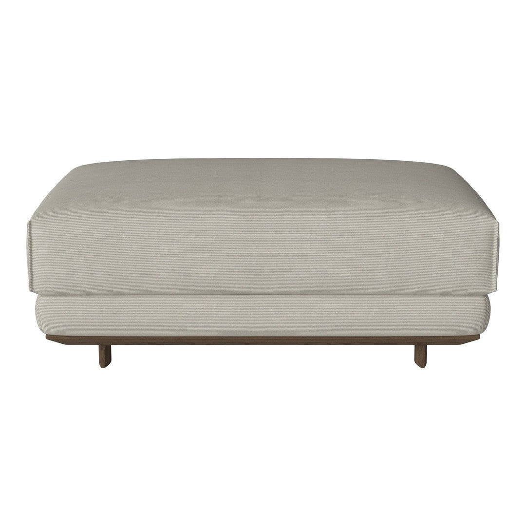 Light grey upholstered ottoman with a minimalist design and smooth, contemporary lines. Ideal for modern decor.