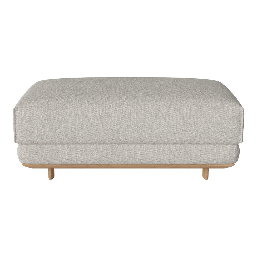 Light gray upholstered ottoman with a sleek design and natural wood legs, featuring a smooth, textured pattern.